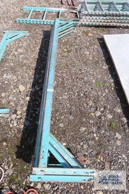 Lot of green roll about scaffolding pieces with boards