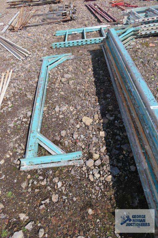 Lot of green roll about scaffolding pieces with boards