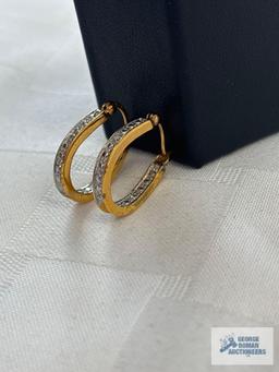 Pair of gold colored hoop earrings, marked 925