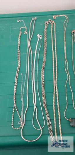 Silver colored costume jewelry necklaces