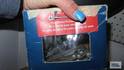 Box of hardware including hinges, nails, washers, bolts, aluminum coil, fire extinguisher