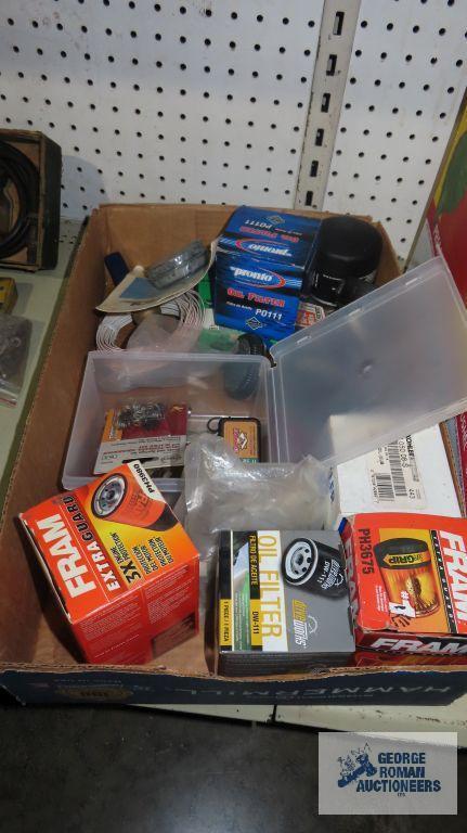 Assorted oil filters, rubber hanger springs for faucets, nails, etc