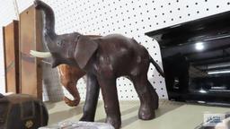 Leather like carved elephant figurine