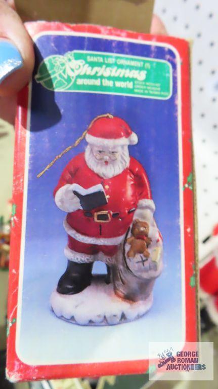 Santa figurines, Coca-Cola ornament, and Christmas candles