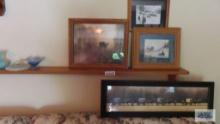 Amish prints, wooden shelf, and candle holders