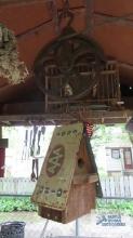 Rustic birdhouse with antique pulley