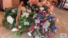 Three floral arrangements in baskets