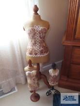 Decorative displays Victorian clothing on pedestal and stand