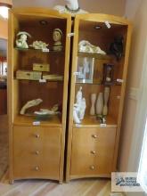 Two lightwood display cabinets with lights