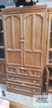 Large entertainment center,...approximately 3 ft long by 77 in tall by 22-1 /2 in deep.