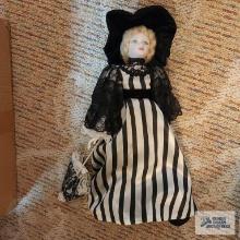Royal Doulton doll in black and white striped dress