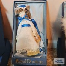 Royal Doulton doll in white dress with blue ribbon
