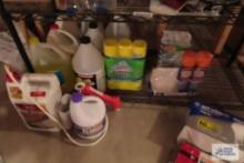 Assorted cleaning supplies and home defense and vinegar