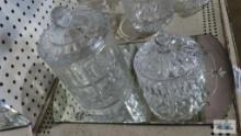 Mirrored tray with decorative covered jars