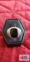 Silver colored black stone ring marked Sterling