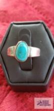 Silver colored ring with turquoise stone no markings found 4.3 G (Description provided by seller)