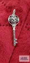 Silver colored key pendant with sparkly stones marked 925 Thailand 2.7 G (Description provided by