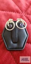 Blue stone silver colored circle shaped earrings marked 585 2.7 G (Description provided by seller)