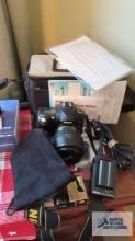 Nikon D50 with lens, booklets, battery with charger, and bag