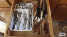 Miscellaneous drawer of serving pieces, knives and etc