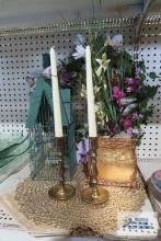 Brass candlesticks, placemats and decorative birdcage and floral decoration