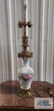 Ornate metal lamp with bird and floral motif. No shade included. 35 in. tall.
