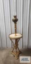 Victorian figurine motif floor lamp with marble top and hurricane shade. 67 in. tall to top of clear