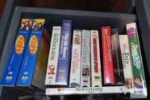 Assorted DVDs and VHS tapes.