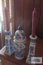 Oriental jardiniere with lid and candlestick holders with candles.