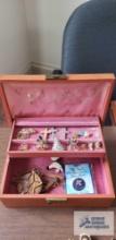 Jewelry box with costume jewelry pins and religious items