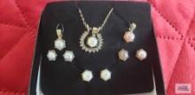 Gold colored with clear gemstone and interchangeable pearl-like pendant and earrings set