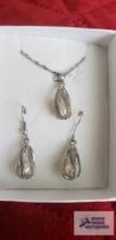 Silver colored and pearl dangle earrings and necklace set