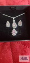 Silver colored pink and clear gemstone necklace, earrings, and ring set
