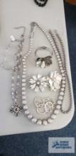 Silver colored costume jewelry necklaces, pins, bracelet, earrings