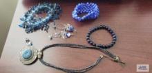 Blue beaded bracelets, necklace, and earrings