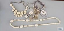 Variety of off-white costume jewelry