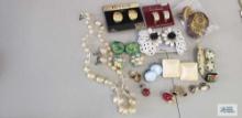 Variety of clip-on earrings, pins, and necklace set
