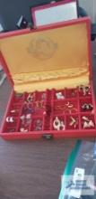 Red Oriental style jewelry box with costume jewelry earrings