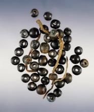 Set of 44 Black Wire Wound Beads with original leather. Townley Reed Site, New York.