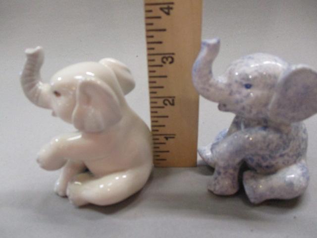 1 Porcelain White Sitting Elephant Marked PG & 1 Blue/White Speckled Sitting Elephant  Marked PG