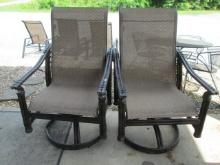 Pair of Castelle Swiveling Rocking Chairs