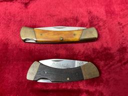Pair of Parker Cut co. Folding Knives, both etched on the blade 1x Canoe & 1x Leopard