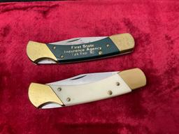 Pair of Coyote Folding Hunter Knives, Etched blade and inlaid company name, Brass and resin handles