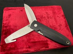 1994 Buck USA 180 Crosslock Folding Hunter Guthook Knife Silver & Black in color