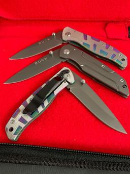 3x New in Box Buck Folding Pocket Knives - 2 in Chromatic motif. All blades are 3" long