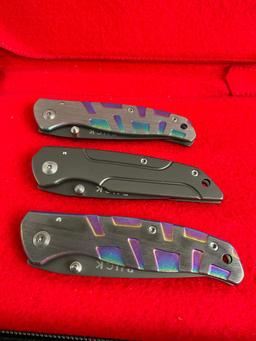3x New in Box Buck Folding Pocket Knives - 2 in Chromatic motif. All blades are 3" long