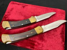 Pair of Buck Folding Hunting Knives, Wood, Brass, and Stainless Steel, #s 110 & 112
