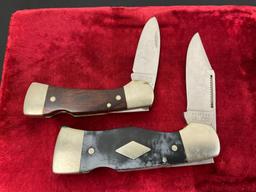 Pair of Western Folding Pocket Knives, models S-521 & S-533, both w/ engraved blades, wooden hand...