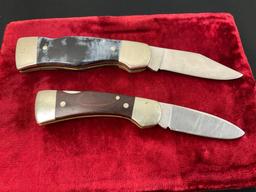 Pair of Western Folding Pocket Knives, models S-521 & S-533, both w/ engraved blades, wooden hand...