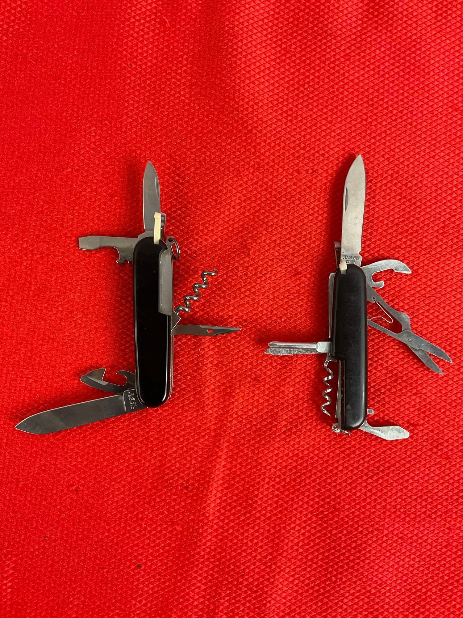 2 pcs Steel Folding Multi-Tool Swiss Army Pocket Knives. 1 Victorinox Officer Suisse, 1 Unmarked.